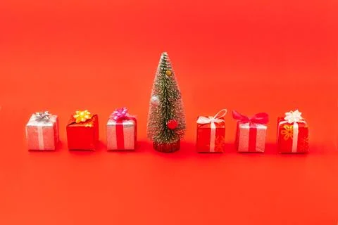 New Year composition. Christmas tree and boxes with gifts, ribbons with bows Stock Photos