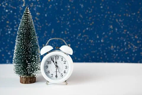 New Year Composition with Clock and Miniature Christmas Tree Stock Photos