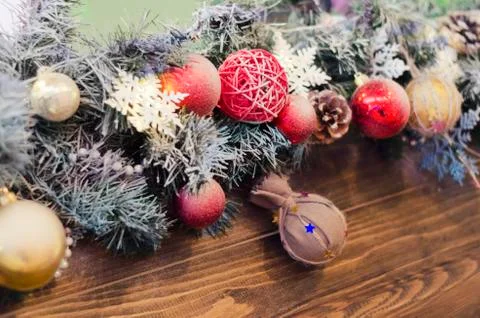 New year composition of colored balls, snowflake on a wooden texture backgrou Stock Photos