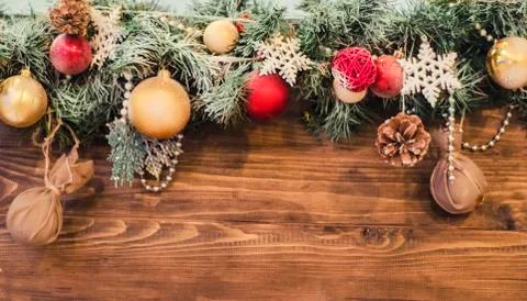 New year composition of colored balls, snowflake on a wooden texture backgrou Stock Photos