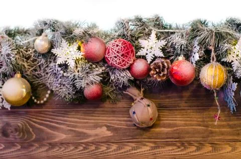 New year composition of colored balls, snowflake on a wooden texture backgrou Stock Photos