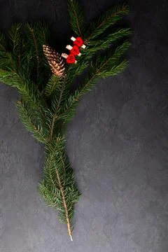 New year composition with pine branches, pine cones and number 2022 on dark v Stock Photos