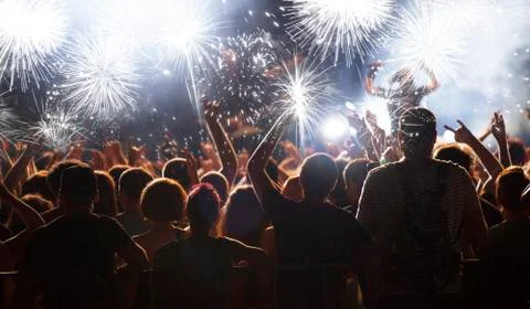 New Year concept - cheering crowd and fireworks Stock Photos