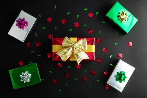 New Year concept. Top view photo of stylish red giftbox with golden ribbon .. Stock Photos