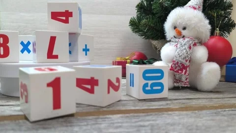 New Year cubes 2025 next to the Christmas tree and Santa. Stock Footage 293015634