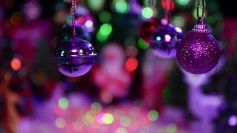 New Year decorations hanging on a half-blurred Christmas background Stock Footage 255912535