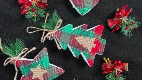 New Year decorations rotating on black background. Flat lay, top view. Stock Footage 218584904