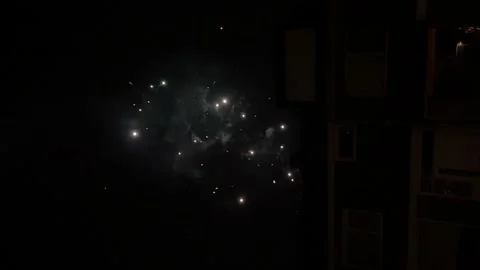 New Year Fireworks Exploding In Sky Beside Building At Night. Vertical Stock Footage 231275109
