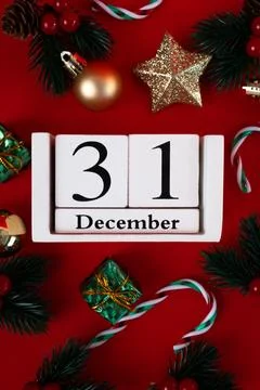 New Year flat lay, December 31 calendar on red background Stock Photos