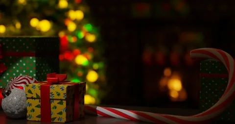 New Year interior with tree ornaments, gift boxes and cozy fireplace decoration. Stock Footage 255963612