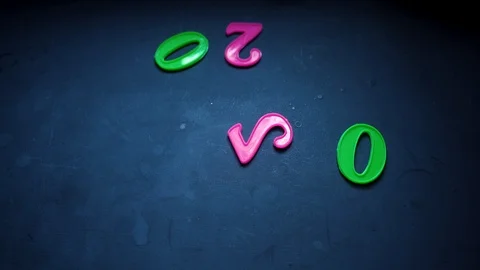 New year numbers falling on surface Stock Footage 121841084