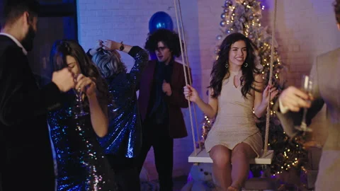 New year party for a stuff group of young people dancing and enjoying the Stock Footage 136407563