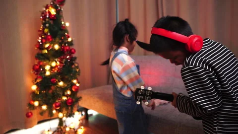 New year partyconcept. Two children asia having fun at New Year party,By singing Stock Footage 253798053