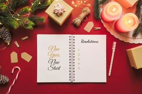New year resolution notebook with checklist of goals and Christmas stuff on r Stock-Fotos