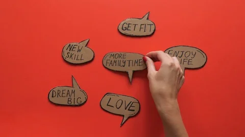 New Year resolutions written in the bubbles appear on the red background. Stock-Footage 120085580