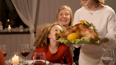 New Year. Served Holiday Table. Woman Serves Chicken Main Dish. Stock-Footage 120282011