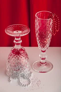 New year still life party themed image with glass and christmas decorations. Stock Photos