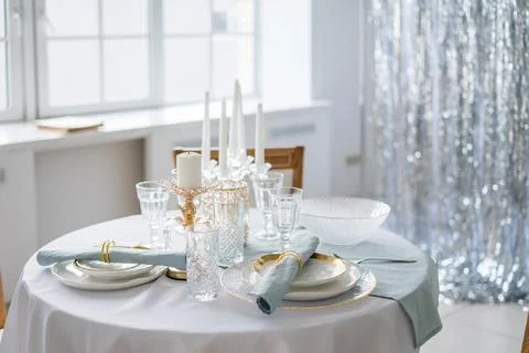 New year table decor in white and silver colors Stock Photos