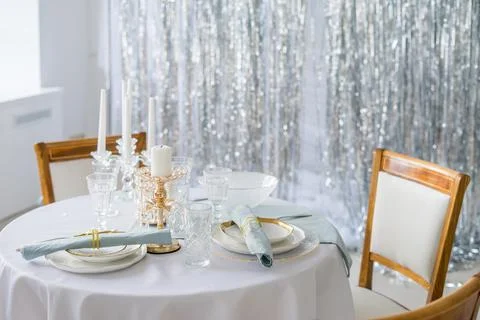 New year table decor in white and silver colors Stock Photos