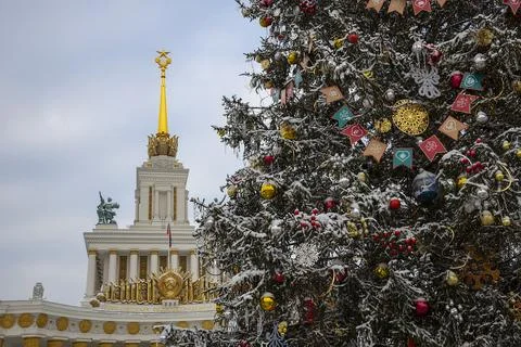 New Year tree on the background of the Central Pavilion. VDNH, Moscow Stock Photos