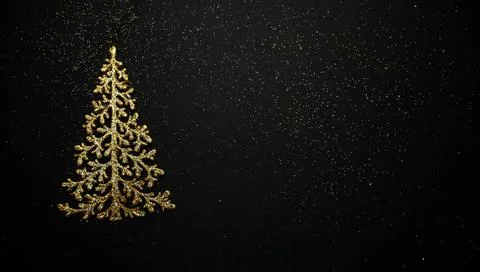 New Year tree on a black background. A festive gift for Christmas. Golden toy Stock Photos
