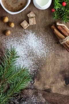 New year tree branches, cones, spices and coffee. Holiday breakfast. Stock Photos