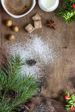 New year tree branches, cones, spices and coffee. Holiday breakfast. Stock Photos