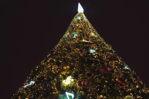 New year tree, decorated with classical toys and illuminated with led lights Stock Photos