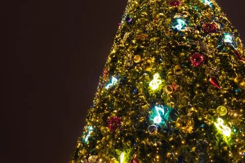 New year tree, decorated with classical toys and illuminated with led lights Stock Photos