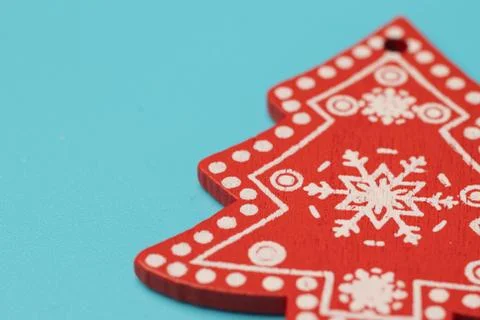 New Year tree with pattern and copy space. Christmas wooden toy on blue backg Stock Photos