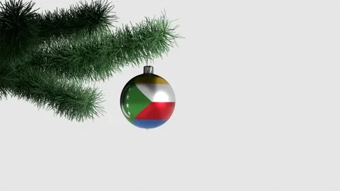New Year's ball with the flag of Comoros on a Christmas tree branch Stockbeeldmateriaal 165487211