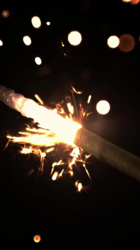 The New Year's Bengal fire glows brightly. Filmed is slow motion 1000 frames per Stock Footage 335285711