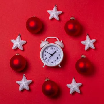 New year's circular composition of a clock in the center, snow-white stars an Stock Photos
