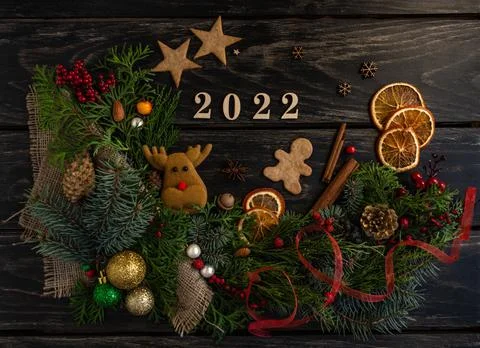 New Year's composition 2022, pine cones, tree, gingerbread, gifts. Flat lay Stock Photos