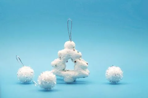 New Year's composition of levitating white Christmas trees and balloons Stock Photos