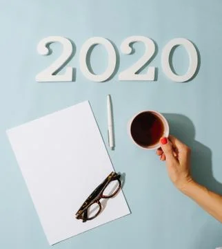 New Year's composition with notebook and cup of coffee. Space for text. Stock Photos