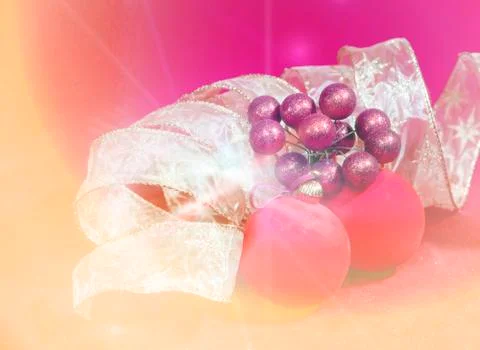 New Year's composition on a red background - ball and ribbon Stock Photos