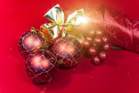 New Year's composition on a red background - ball and ribbon Foto stock