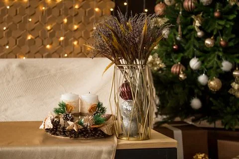 New Year's composition on the table. Cones, candles, spruce branches, bouquet Stock Photos