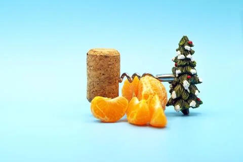 New Year's composition of tangerines, corkscrew and cork Stock Photos
