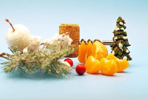 New Year's composition of tangerines, corkscrew and cork Stock Photos