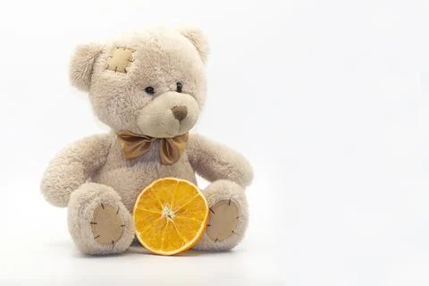New Year's composition with a teddy bear and an orange Stock Photos