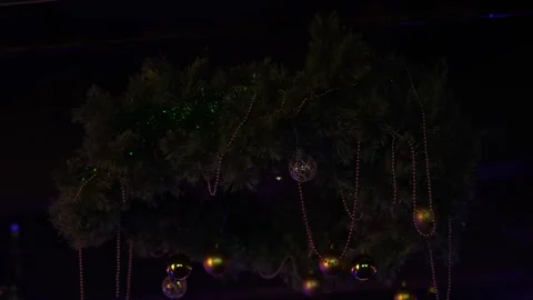 A New Year's decoration hangs on the ceiling of a nightclub Video stock 324524120