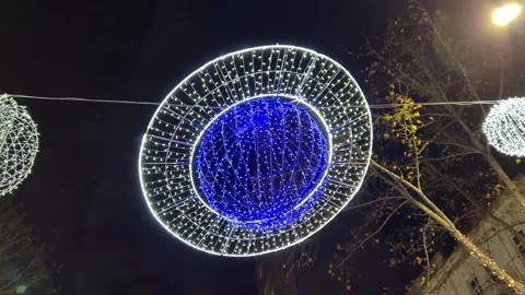 New Year's decoration made of light bulbs in form of blue planet Saturn Stock Footage 259683250