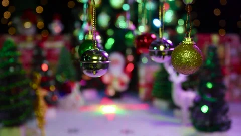 New Year's decorations swing on a half-blurred Christmas background Stock Footage 255912582