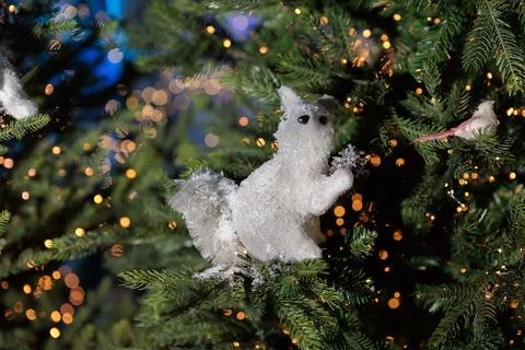 New Year's decorations, toys and garlands in fabulous settings. Toy animals Фото
