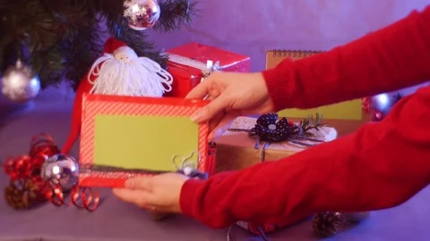 New Year's Decorative Composition Where a Woman Puts a Frame For Your Text and Stock Footage 72884451