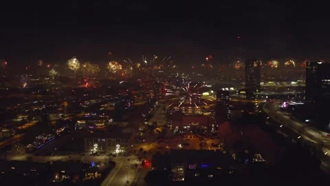 New Year's Eve Fireworks Exploding Over Icelandic Cityscape On Winter Night Stock Footage 306277476