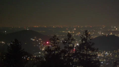 New Years Eve fireworks exploding over illuminated night city Stock Footage 336200406