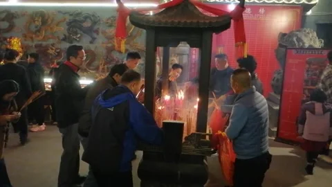 On New Year's Eve, people go to temples to burn incense and pray for blessings Stock Footage 300318624